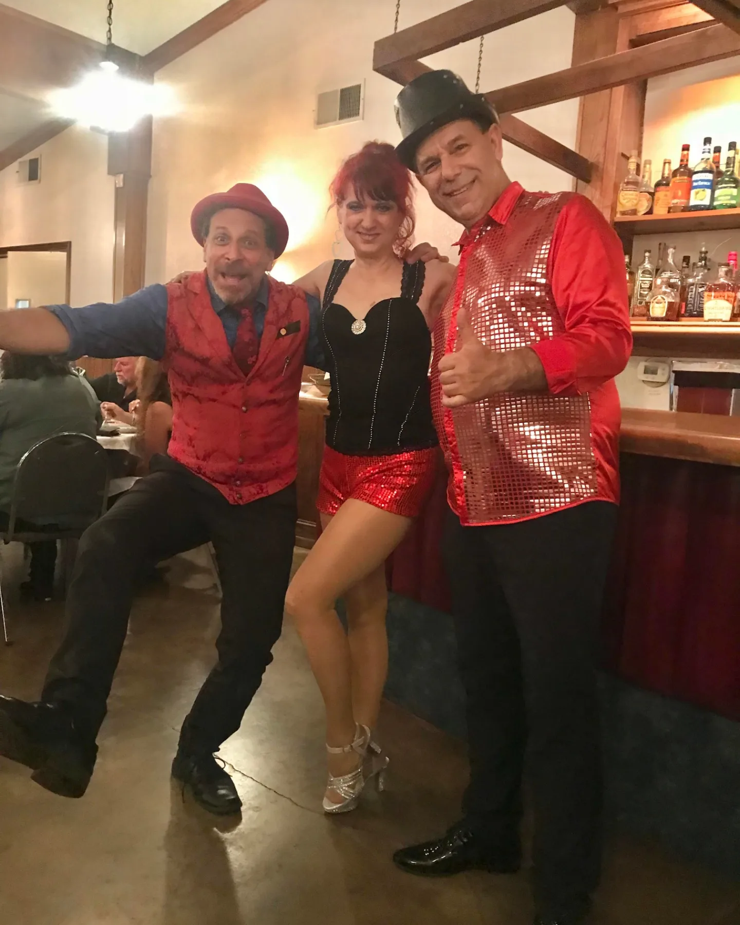Sharpo posing  with Stoil Stoilov and Ekaterina at the Enchantment and Magic Dinner Show at Le Chene in Santa Clarita on July 14th, 2023. 
