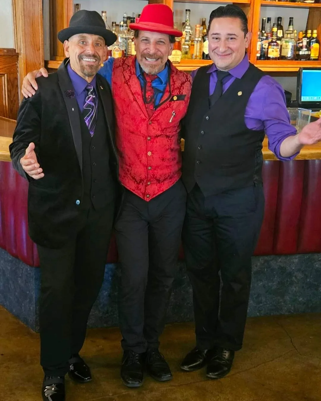 Magicians Sharpo, Raven & Migz pose at the bar for Enchantment & Magic Dinner Show at Le Chene om July 14th, 2023.  